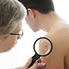 male_doctor_mole_checking_skin_cancer_male_patient_100x100