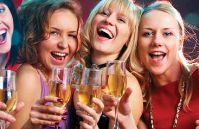 Beautiful women drinking champagne at a party