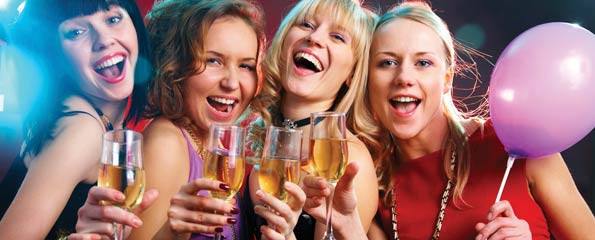 Beautiful women drinking champagne at a party