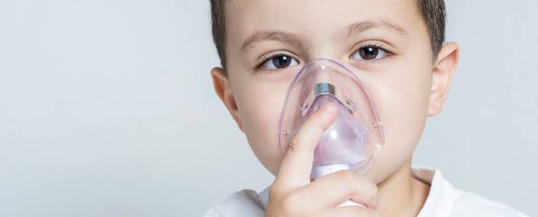 boy having asthma treatment