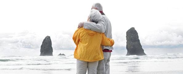 Senior couple embracing on beach