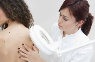 woman at dermatology examination