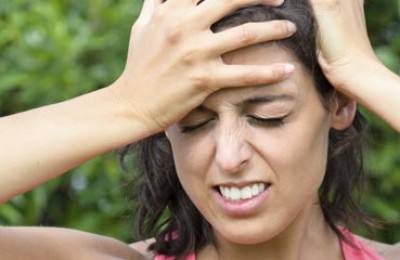 Woman painful head ache