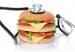Unhealthy burger with stethoscope, cholesterol